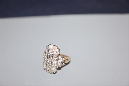 A mid 20th century Art Deco style yellow metal and plat, diamond cluster tablet ring, size K.